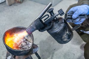 Worker Melting Lead - Foundry Faces Fine For Lead Exposure, Other Hazards