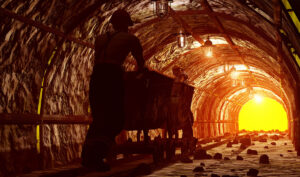 Worker walking in mine - silica coal dust