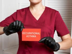 Occupational Asthma - nurse holding a sign