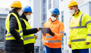 A group of four safety inspectors conducting a workplace inspection